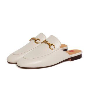 Beige leather flat horsebit mules